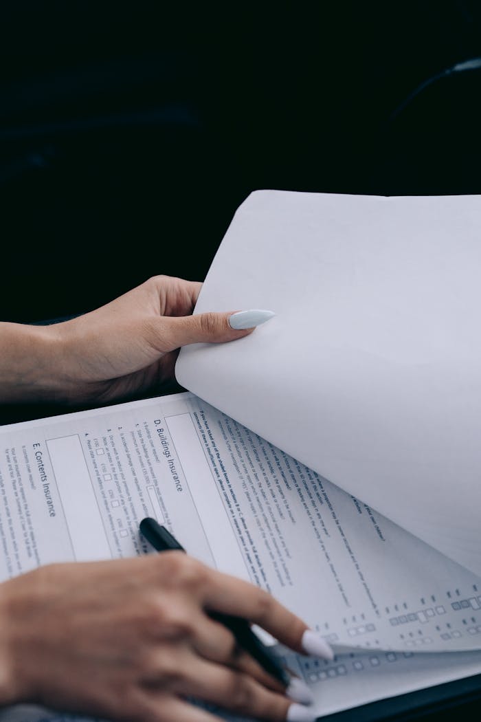 Woman Signing Documents